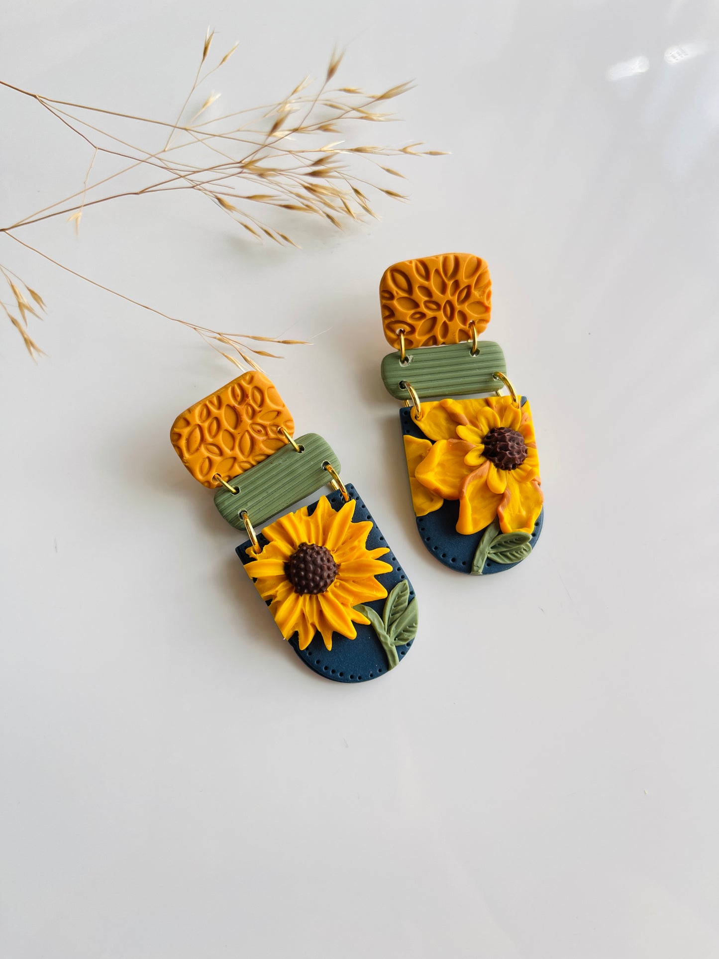 sunflower on blue polymer clay earring