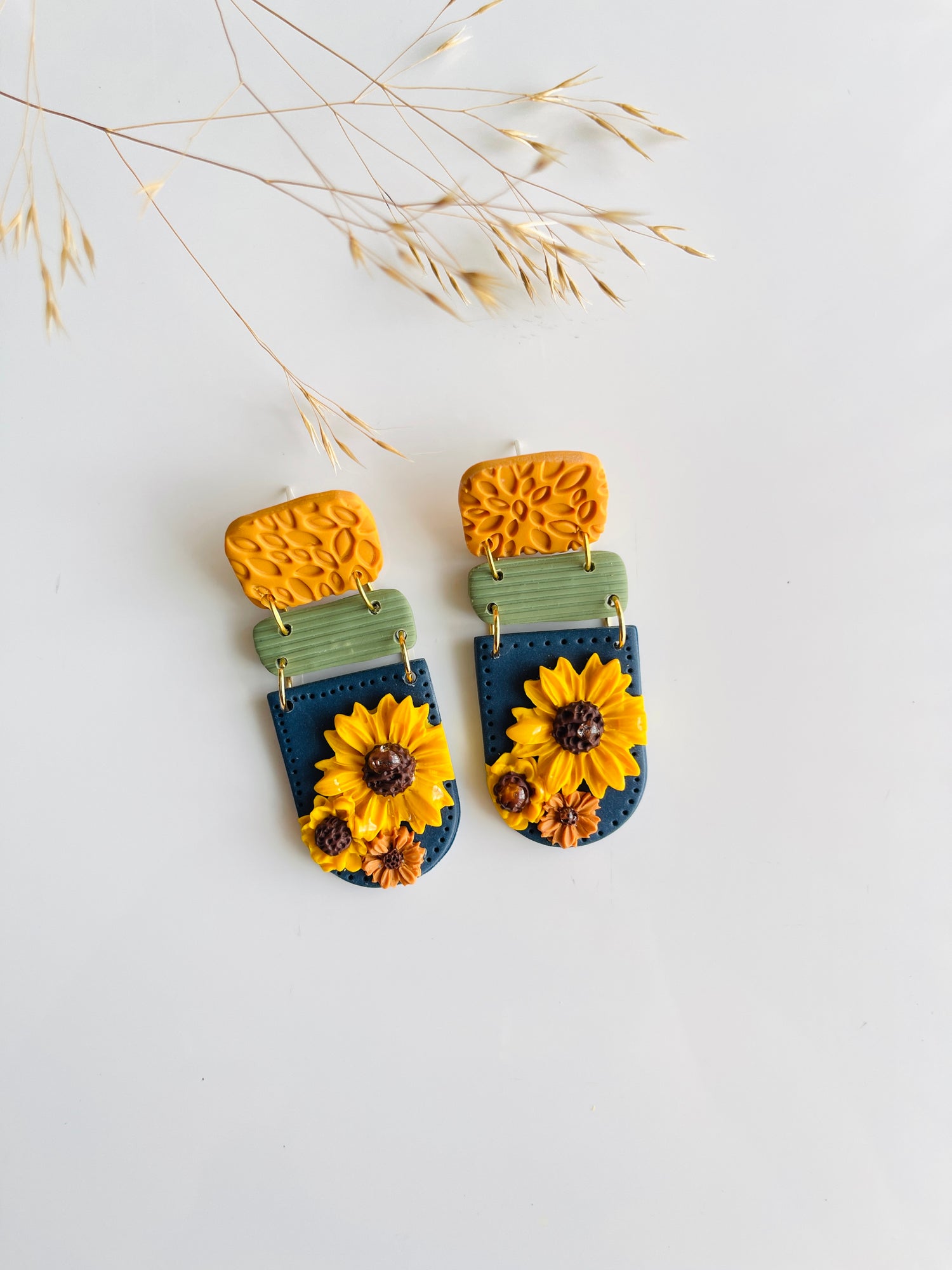 sunflower on blue polymer clay earring